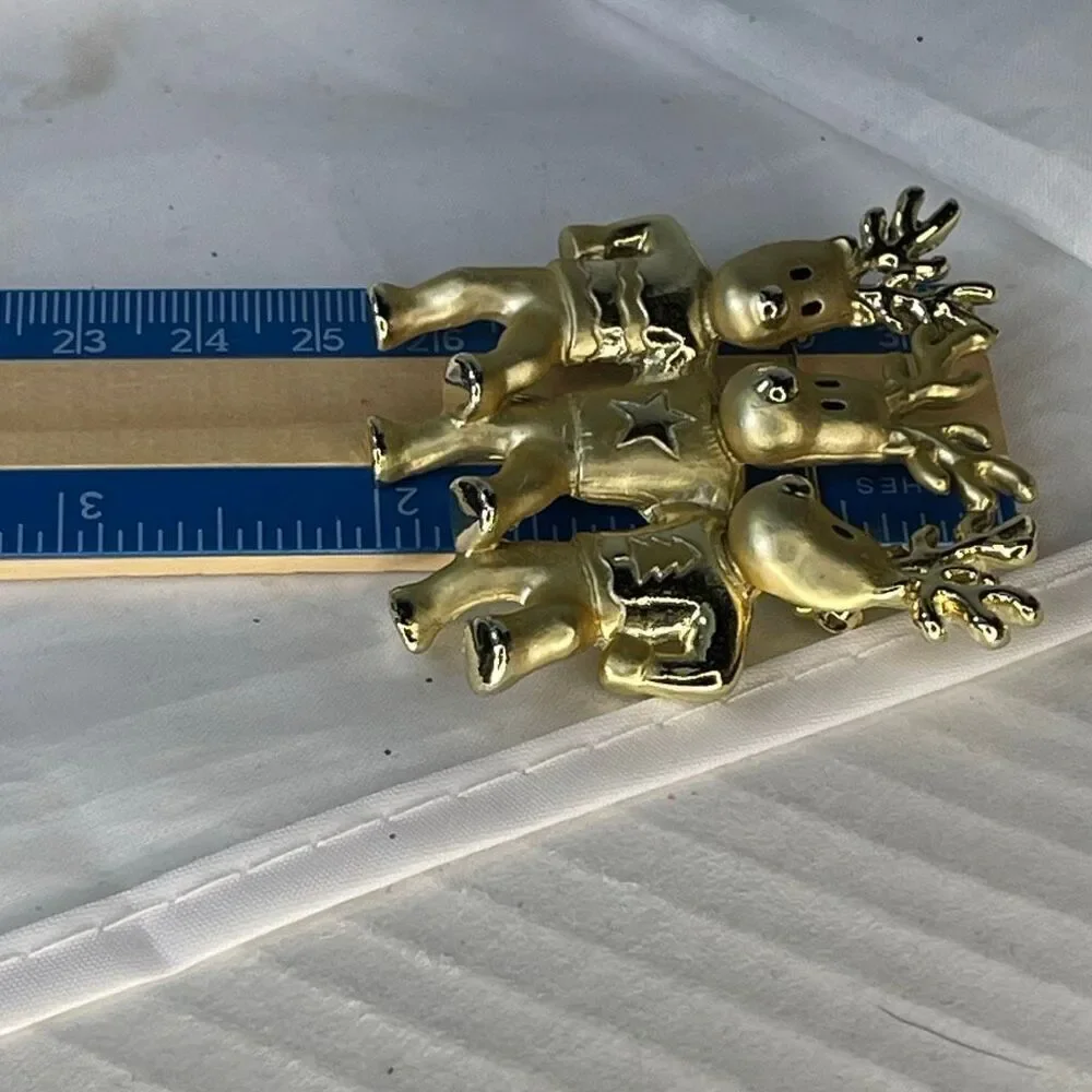 Vintage AJC three dancing deer gold tone brooch.
